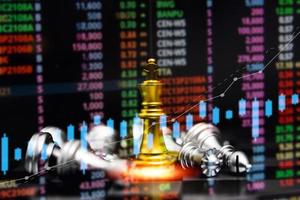 jogo de xadrez a bordo indicadores gráficos forex e gráfico mercado de ações finanças investimento negócio marketing digital conceito de finanças. foto