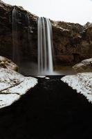 lapso de tempo de uma cachoeira na Islândia foto