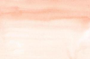 textura de fundo gradiente coral luz aquarela. pinceladas no papel. pano de fundo de cor de pêssego. foto