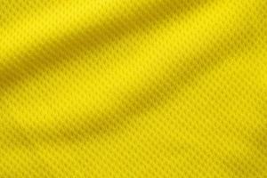 cor amarela camisa de futebol roupas tecido textura esportes desgaste fundo, fechar foto