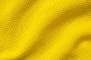 amarelo roupas esportivas tecido camisa de futebol jersey textura fechar foto