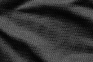 tecido de pano esporte preto camisa de futebol textura de camisa close-up foto
