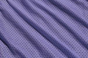 textura de roupas esportivas feitas de fibra de poliéster. agasalhos para treinamento esportivo tem uma textura de malha de tecido de nylon elástico foto