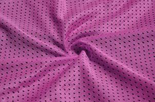 textura de roupas esportivas feitas de fibra de poliéster. agasalhos para treinamento esportivo tem uma textura de malha de tecido de nylon elástico foto