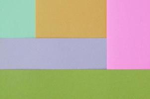 fundo de textura de cores pastel da moda. papéis de padrão geométrico rosa, violeta, laranja, verde e azul foto