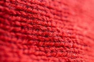 fundo de textura de tecido de lã de malha vermelha closeup foto