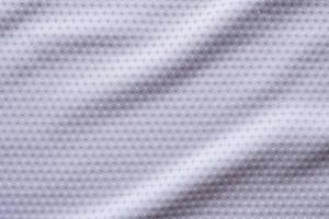 tecido branco roupas esportivas camisa de futebol com fundo de textura de malha de ar foto