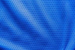 tecido de cor azul roupas esportivas camisa de futebol com fundo de textura de malha de ar foto