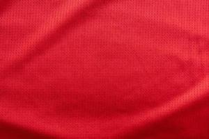 roupas esportivas tecido camisa de futebol textura vista superior cor vermelha foto