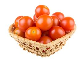 tomate cereja em branco foto