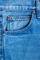 closeup de fundo de textura de bolso de jeans azul foto