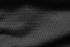 tecido de pano esporte preto camisa de futebol textura de camisa close-up foto