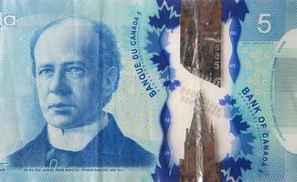 retrato de sir wilfrid laurier do canadá fragmento de notas de polímero de 5 dólares de 2013 foto