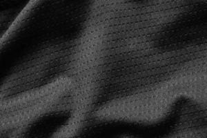 tecido de pano esporte preto camisa de futebol textura de camisa close-up foto