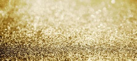 brilho de glitter dourado abstrato com fundo bokeh foto