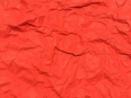 fundo de textura de papel amassado vermelho para design. papel de parede para espaço de cópia foto