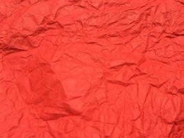 fundo de textura de papel amassado vermelho para design. papel de parede para espaço de cópia foto