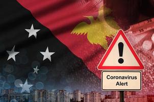 bandeira de papua nova guiné e sinal de alerta coronavírus 2019-ncov. conceito de alta probabilidade de surto de novo coronavírus através de turistas que viajam foto