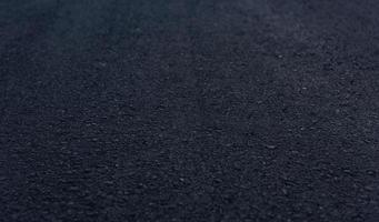 detalhes de textura da superfície do asfalto na nova estrada com vinheta. foto