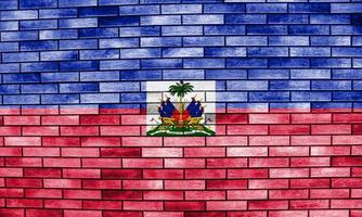 bandeira da república do haiti na textura de uma parede de tijolos. foto