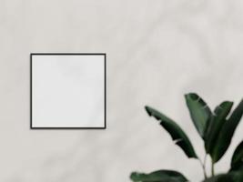 vista frontal limpa e minimalista quadrada preta quadrada ou maquete de moldura de cartaz pendurada na parede com planta. renderização 3D. foto