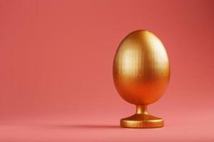 ovo de ouro em um fundo rosa com um conceito minimalista. espaço para texto. modelos de design de ovo de páscoa. decoração elegante com conceito mínimo. foto