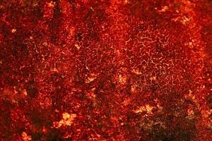 textura de lava quente vermelha. erupção vulcânica. pano de fundo brilhante do espaço. foto