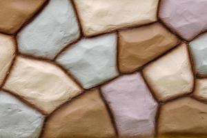 textura de parede de pedra na cor marrom e uso de cor rosa para o fundo. foto