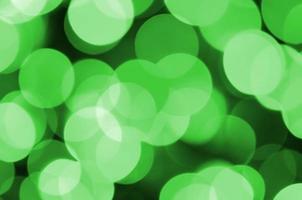 verde abstrato natal turva fundo luminoso. imagem de luzes bokeh artísticas desfocadas foto
