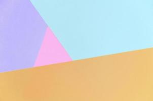 fundo de textura de cores pastel da moda. papéis de padrão geométrico rosa, violeta, laranja e azul. foto