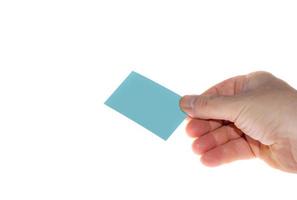 mão segure o cartão de visita de cor em branco foto