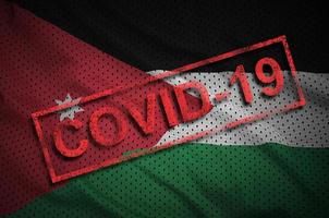 bandeira da Jordânia e carimbo vermelho covid-19. surto de coronavírus 2019-ncov foto