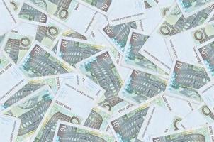 10 notas de kuna croatas estão em uma grande pilha. fundo conceitual de vida rica foto