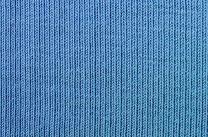 a textura do tecido na cor azul. material para fazer camisas e blusas foto