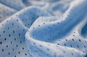 padrão de fundo têxtil de tecido de malha azul esporte desgaste foto