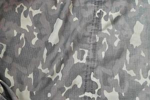 textura de fundo de camuflagem como pano de fundo para projetos de design de serviço militar foto
