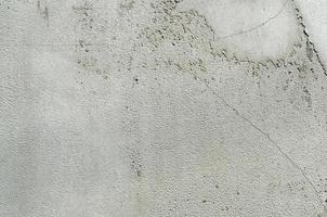 parede de estuque branco. textura de parede de cimento pintado sujo cinza foto