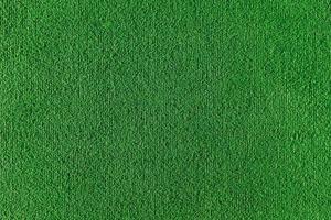 textura perfeita do campo de grama artificial. textura verde de um campo de futebol, vôlei e basquete foto