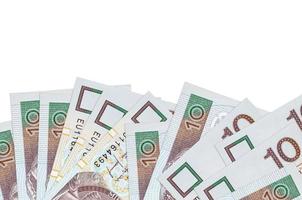 10 contas de zloty polonesas estão na parte inferior da tela isoladas em fundo branco com espaço de cópia. modelo de banner de fundo foto