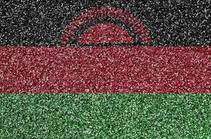 bandeira do malawi retratada em muitas pequenas lantejoulas brilhantes. fundo festival colorido para festa foto