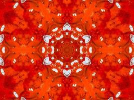 caleidoscópio de fogo vermelho colorido flor abstrata de fundo e padrão simétrico foto