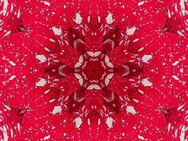 fundo de caleidoscópio floral vermelho abstrato padrão único e simétrico para vibrações de natal foto