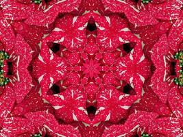 fundo de caleidoscópio floral vermelho abstrato padrão único e simétrico para vibrações de natal foto