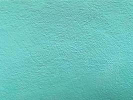 textura perfeita da parede de cimento de cor azul oceano uma superfície áspera, com espaço para texto, para um fundo. foto