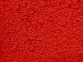 textura perfeita da parede de cimento vermelho uma superfície áspera, com espaço para texto, para um fundo. foto