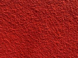textura perfeita da velha parede de cimento vermelho uma superfície áspera, com espaço para texto, para um plano de fundo. foto