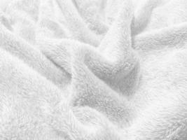 fundo de textura de lã limpa branca. lã de ovelha natural leve. algodão sem costura branco. textura de pele fofa para designers. tapete de lã branca de fragmento de close-up. foto