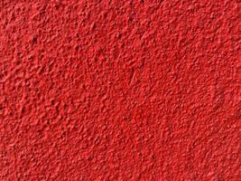 textura perfeita da velha parede de cimento vermelho uma superfície áspera, com espaço para texto, para um plano de fundo. foto