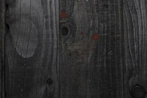 superfície de madeira escura monocromática que pode ser usada como fundo para algumas imagens foto