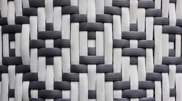 material de rattan sintético tricotado com textura tradicional em preto e branco para papel de parede e fundo. foto